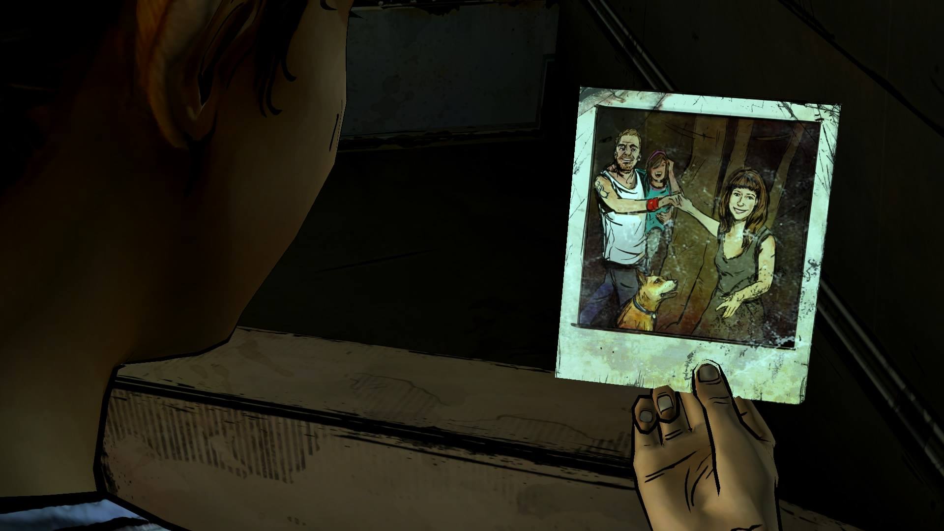 Clementine examines a photo of a family