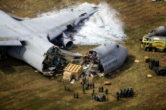 plane cargo crash dover air force spokesman crashed base aboard survive review respond crews emergency 5b monday del 2006 associated