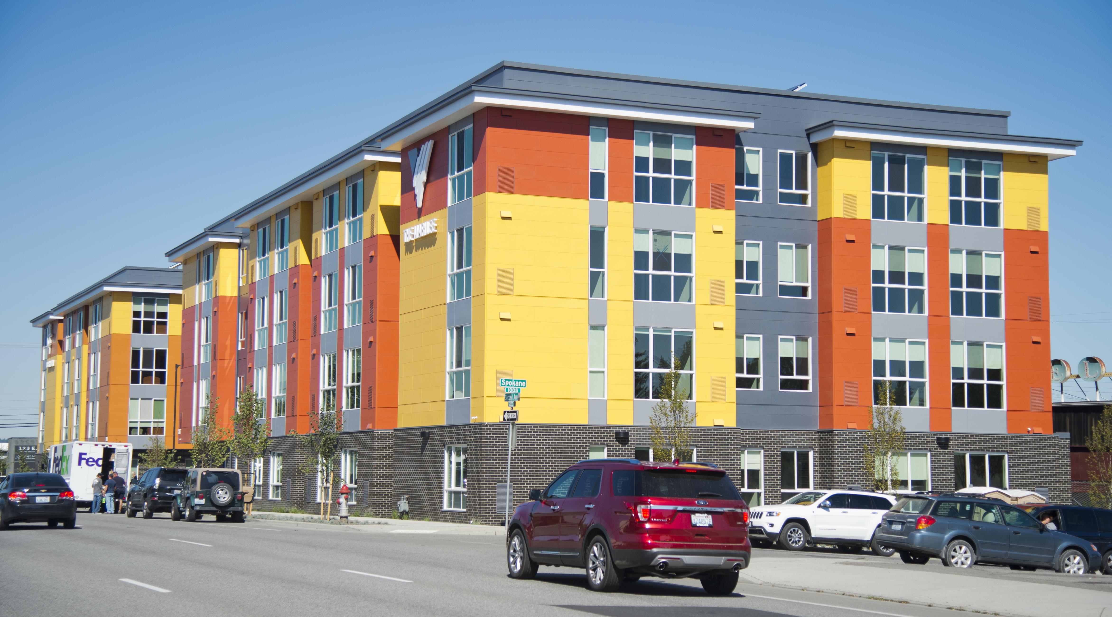 Volunteers Are Setting Up Beds For New Low Cost Housing Facility In The Two New Brightly Colored Apartment Buildings Built By Catholic Charities And Volunteers Of