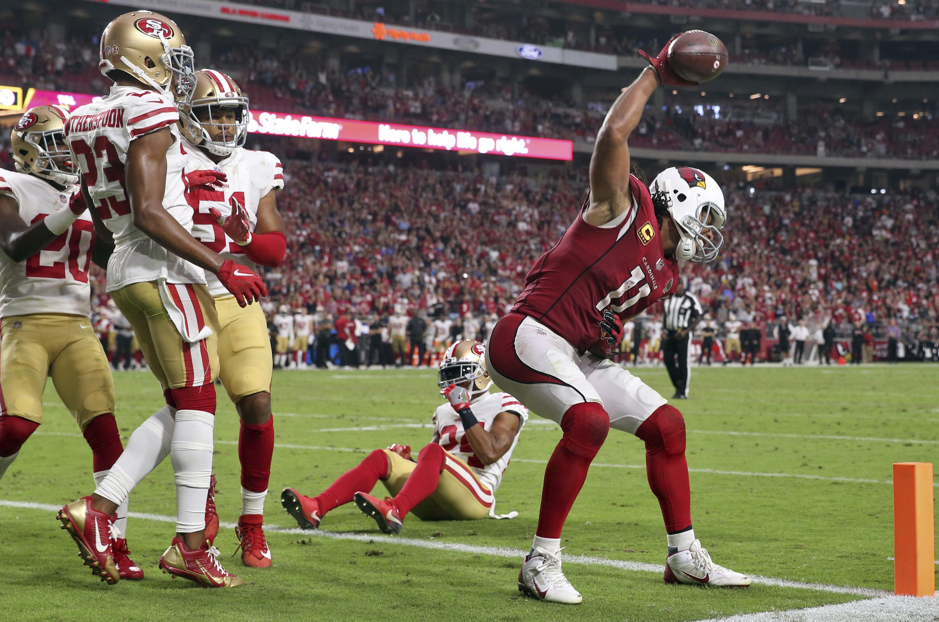 Larry Fitzgerald was so upset his son skipped his NFL game, he spiked a