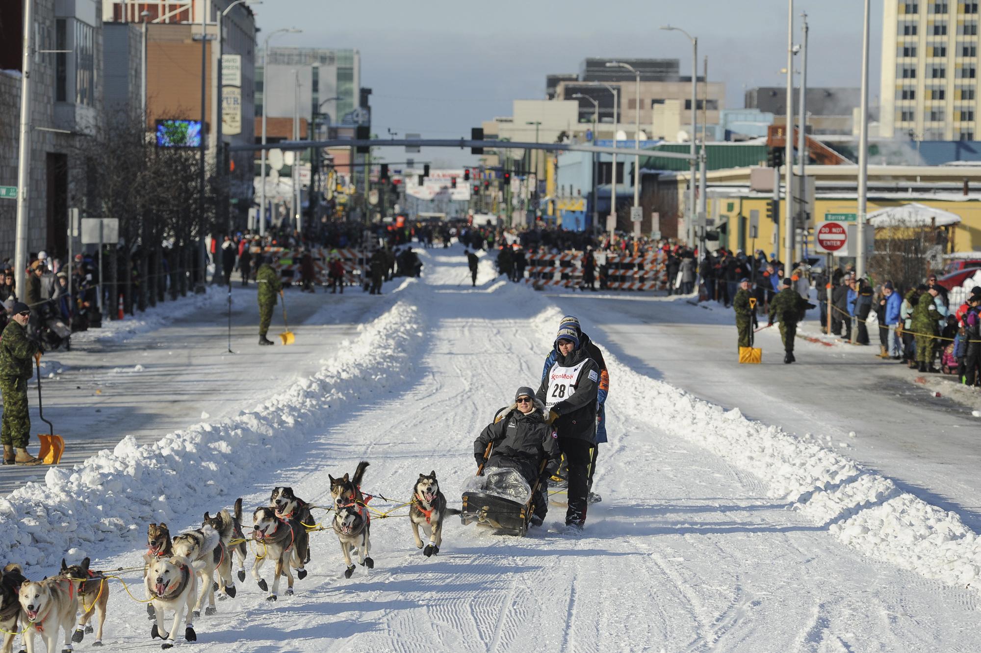 big-crowds-cheer-kick-off-of-alaska-s-famed-iditarod-race-the-spokesman-review