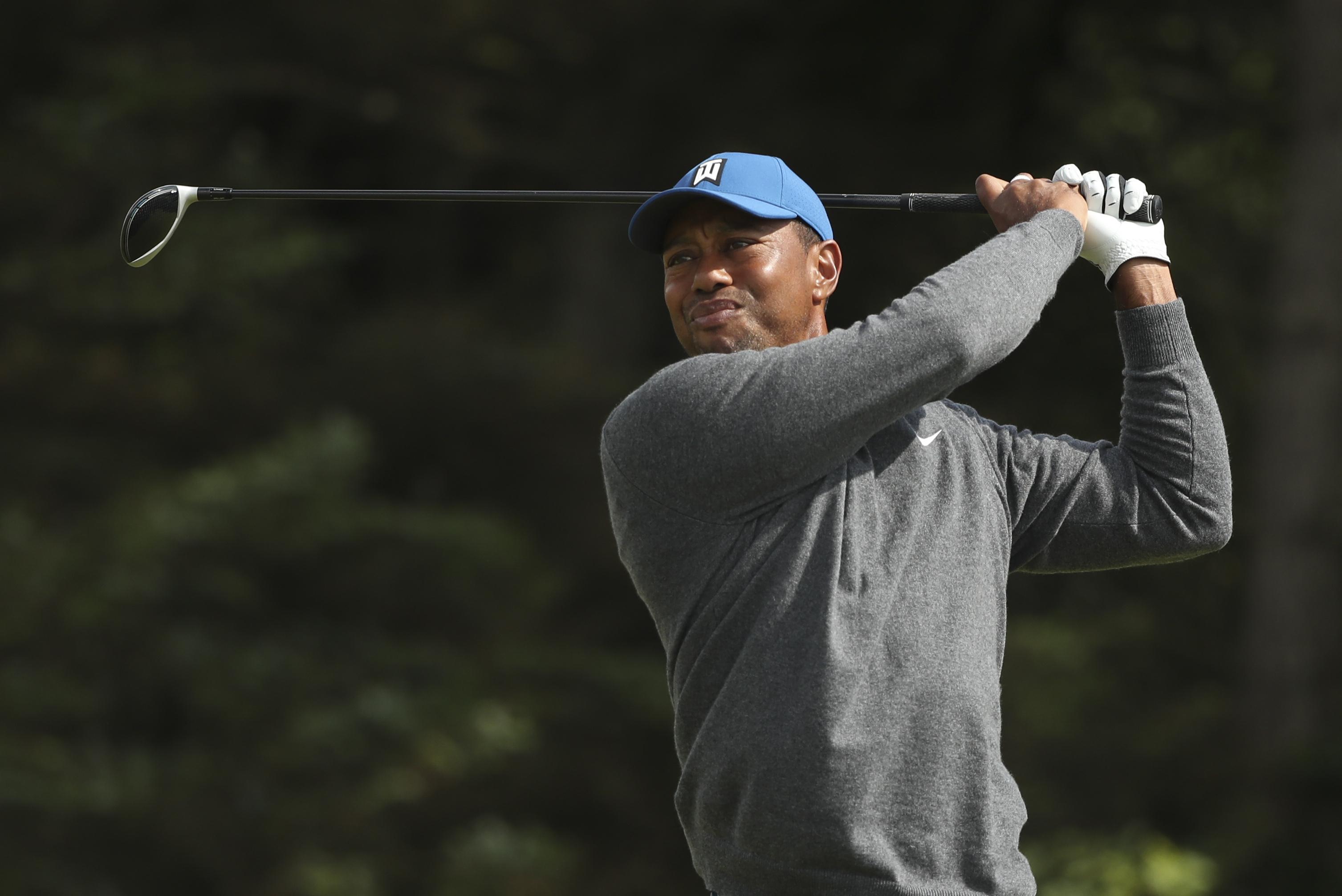The usual crowd support saw an unusual score for Tiger Woods | The Spokesman-Review