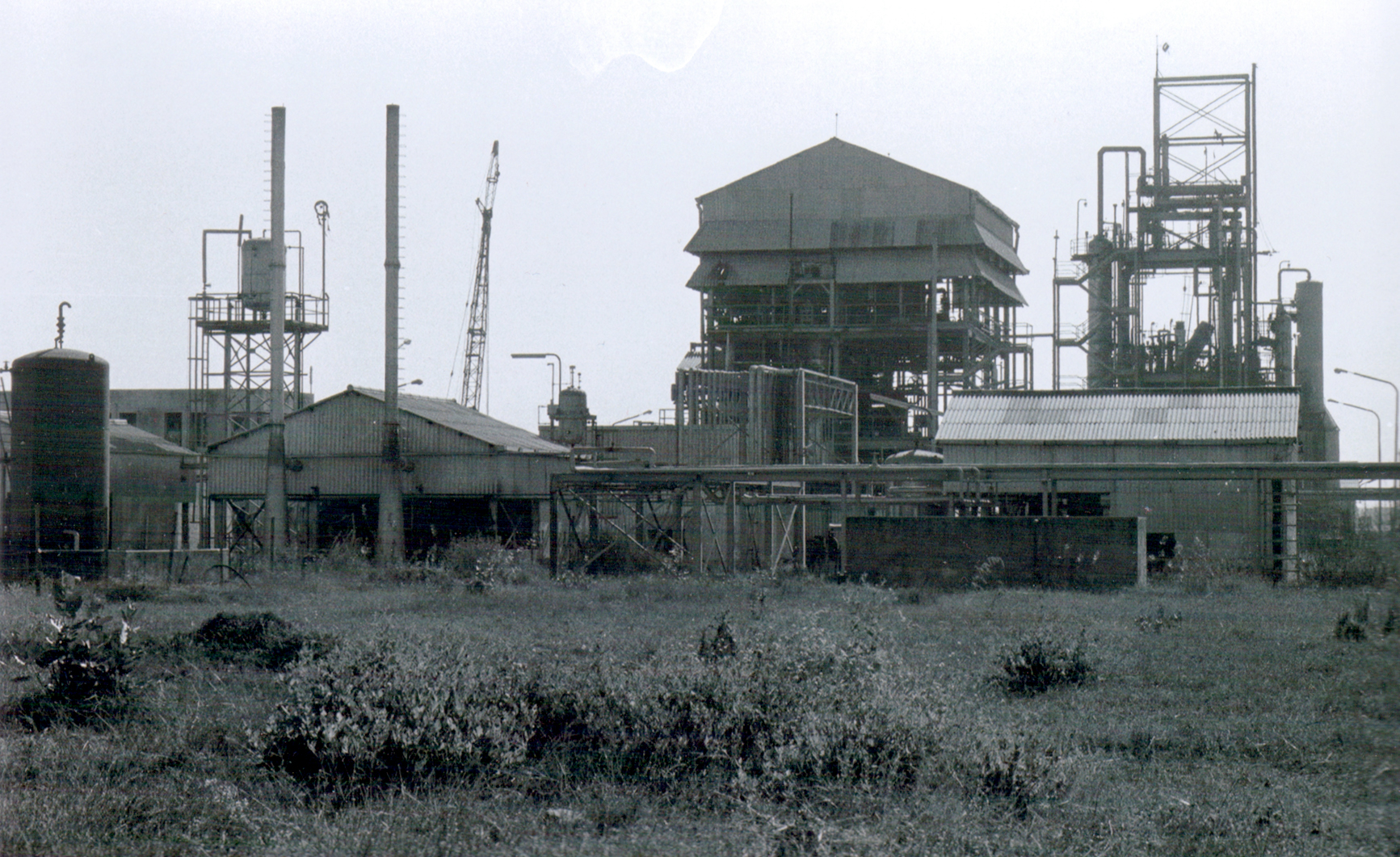 The Union Carbide pesticide plant in Bhopal, a year or so after the leak. Thousands of tons of toxic waste are said to still be present on the site. Sourced from the Bhopal Medical Appeal