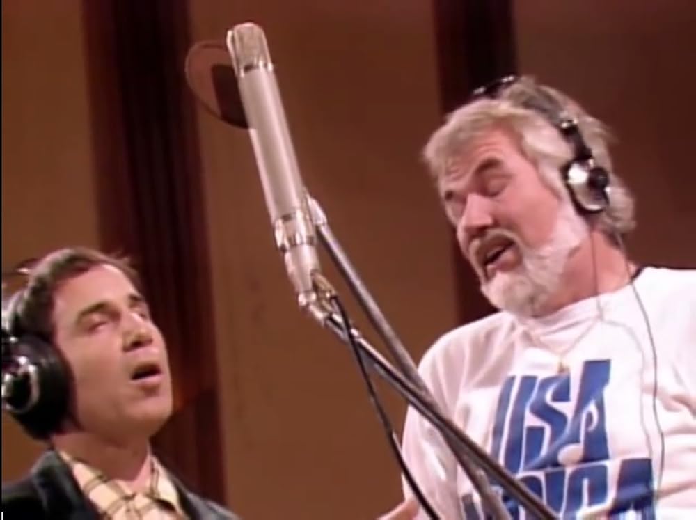 ... before handing off to Paul Simon and Kenny Rogers.