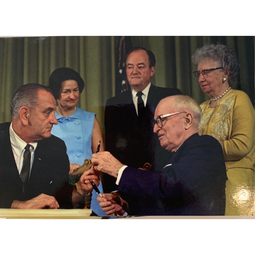 After signing the legislation, LBJ awarded the pens he had used to President and Mrs. Truman.