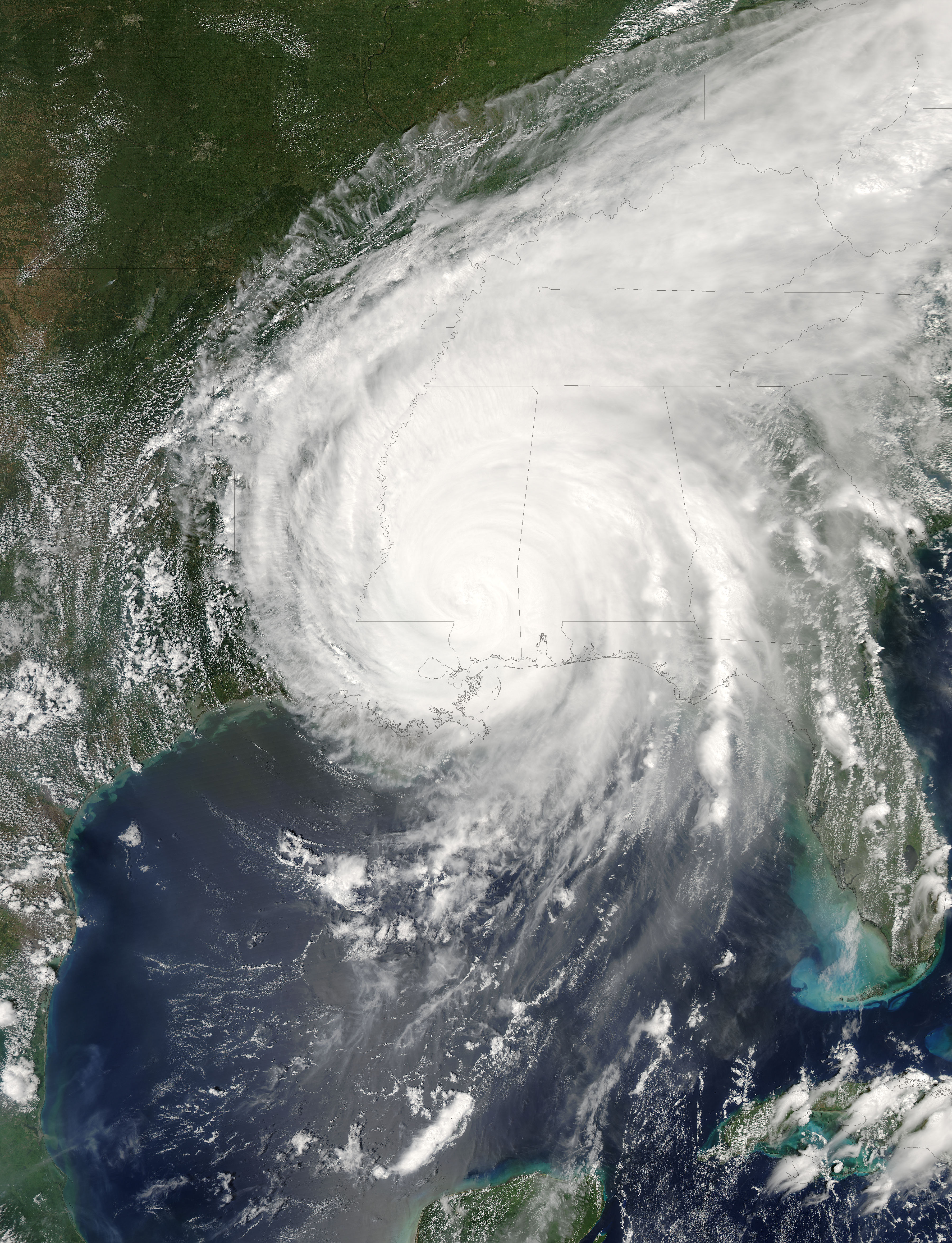 Katrina made landfall early on Aug. 29, 2005, with winds in excess of 125 mph and a storm surge of 12 to 14 feet. Photo sourced from NASA Earth Observatory.