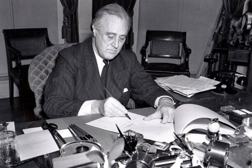 Roosevelt signs the Lend-Lease act on March 11, 1941. Photo sourced from the Library of Congress.