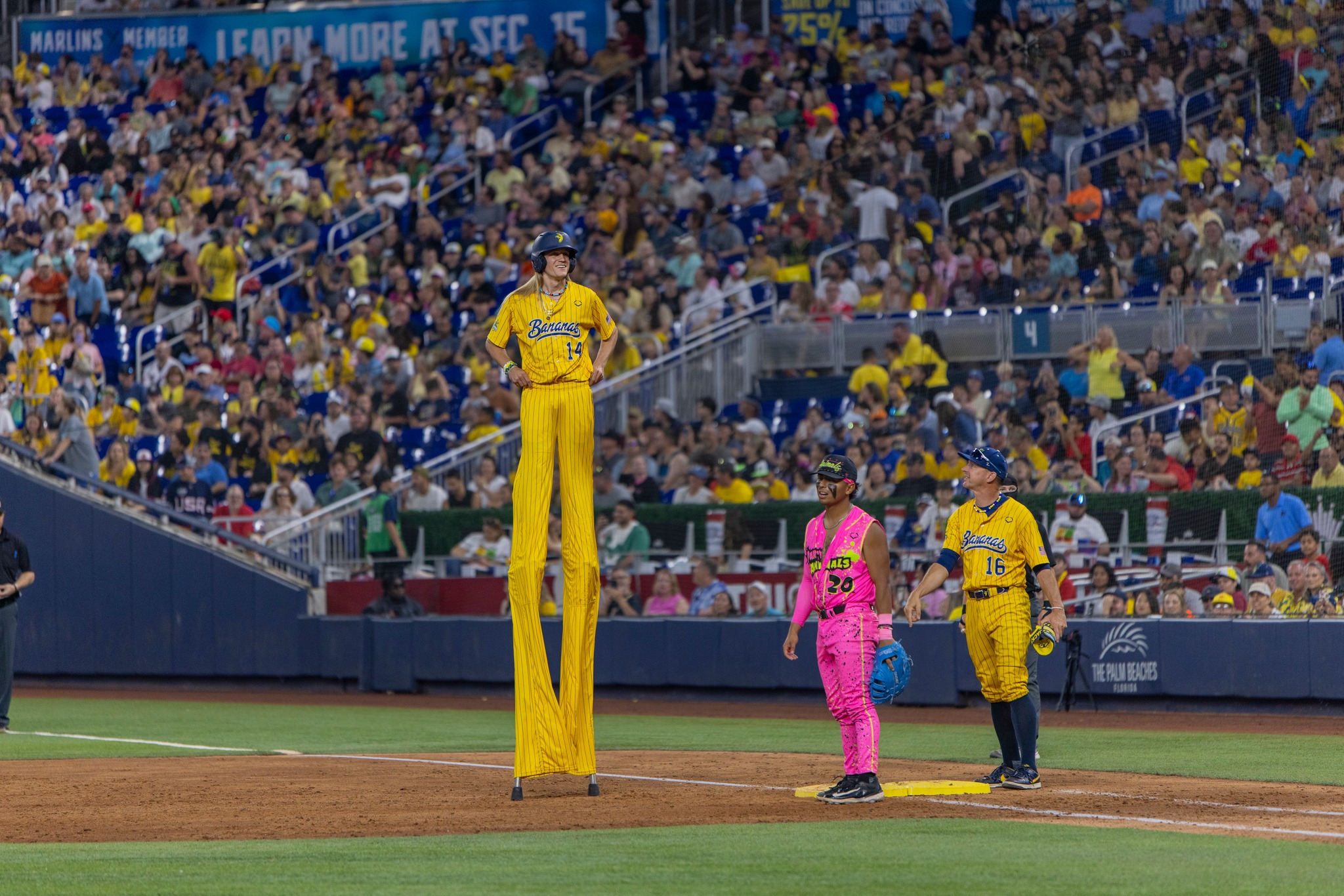Just part of the spectacle at a Savannah Bananas game is pitcher Dakota Albritton who plays atop a pair of stilts, making him 10 feet, 9 inches tall. One has to wonder about the size of his strike zone when at bat.