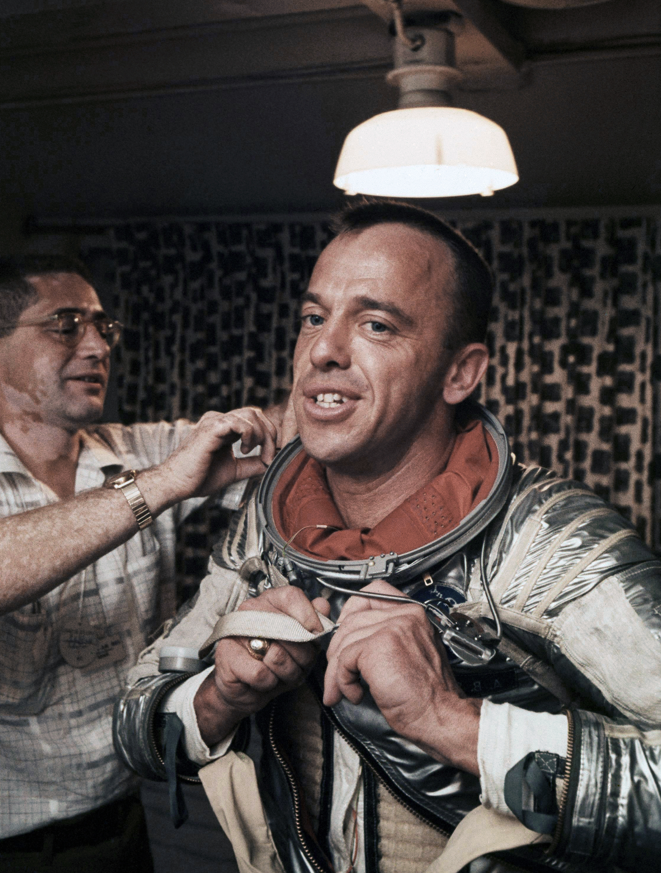Alan Shepard being helped out of his space suit after the mission. Photo by the Associated Press.