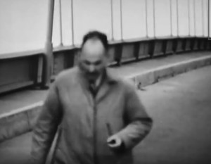 Leonard Coatsworth shuffles off the bridge, moments before it collapses.