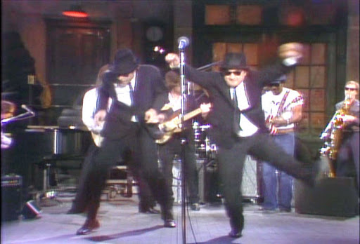 April 22, 1978: Wearing suits, hats and Ray-Bans and singing “Hey Bar-tender.”