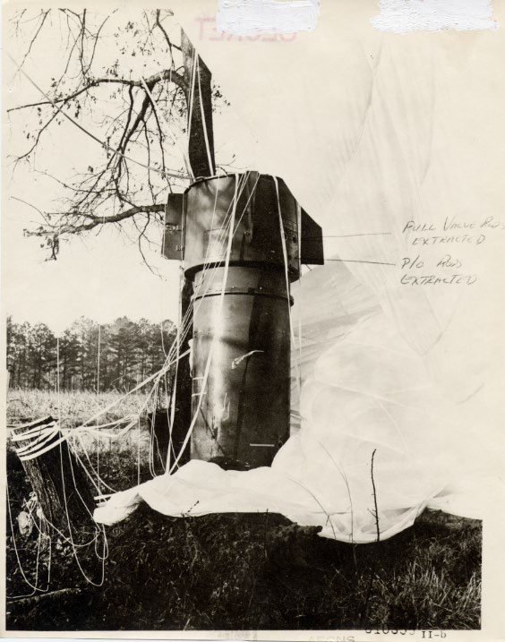 One of the two bombs landed in a field and was found with its parachute draped over a tree. Pins that provided power from a generator to the weapon had been yanked, which prevented the bomb from going off. In other words, the fail-safe safety devices had performed their duties as designed.