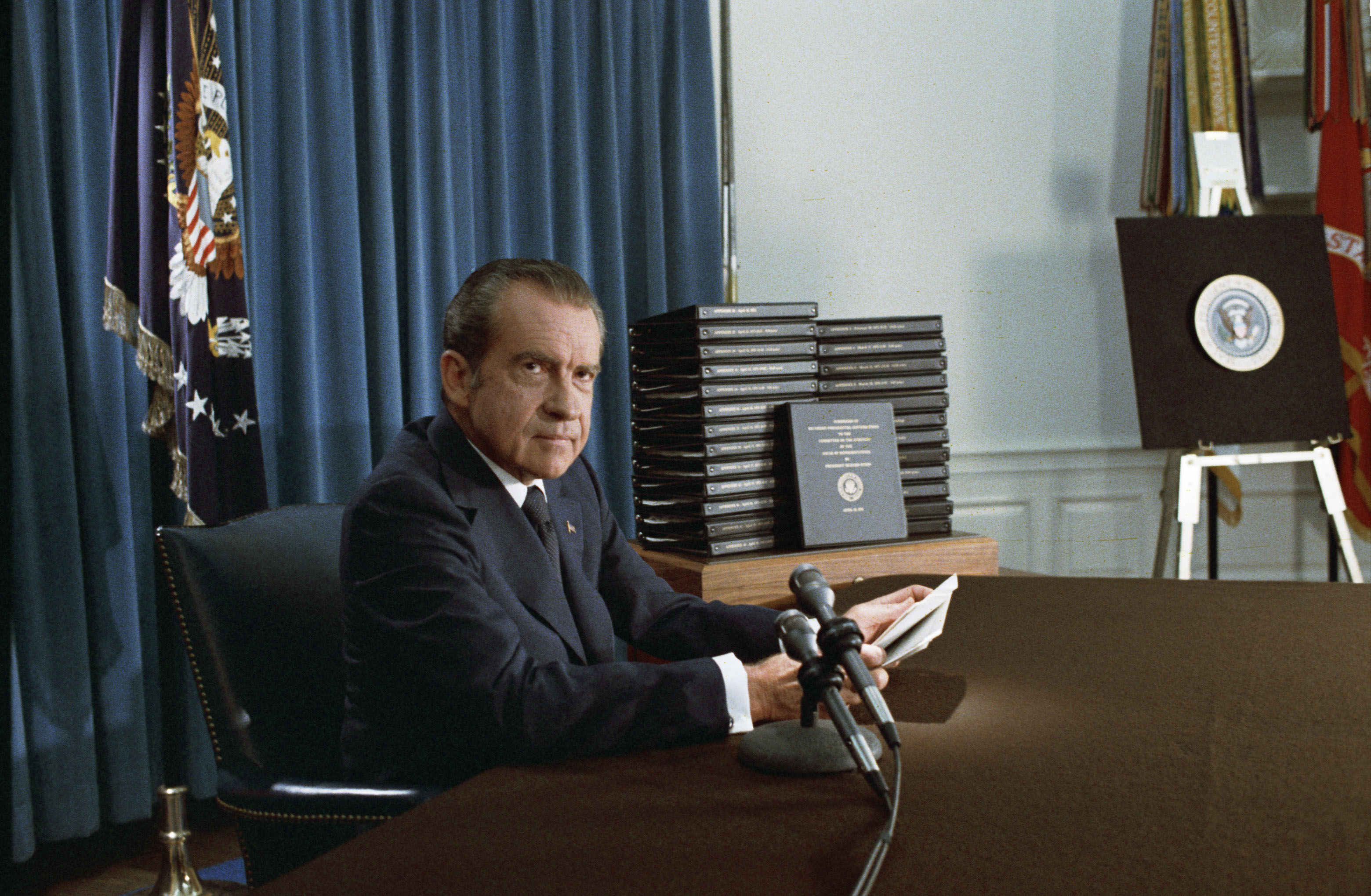 Nixon and his transcripts on April 29, 1974. Photo from National Archives.