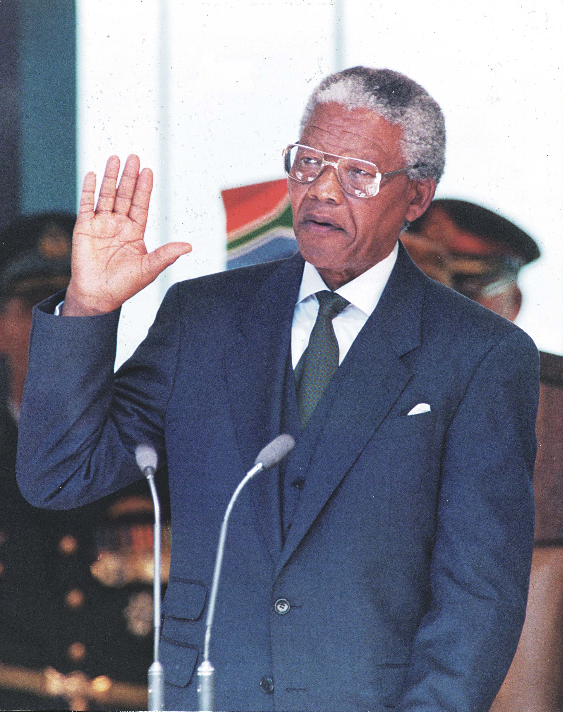 Mandela is sworn in as president of South Africa on May 10, 1994. He calls for “a time of healing” and vows to fight for his “rainbow nation.” Photo from Media 24.